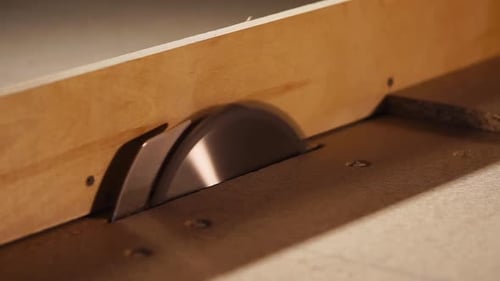 Close Up Shot of the Saw Is Located in a Factory for the Production of Furniture