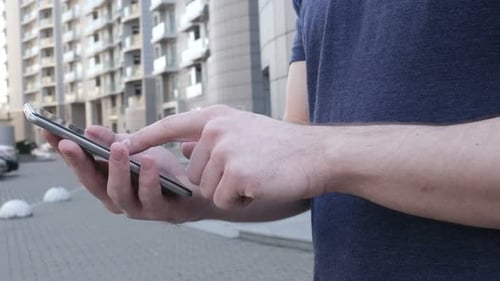 Man Is Using A Smartphone