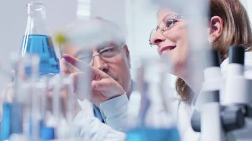 Handheld Shot of Researcher Working in Modern Laboratory