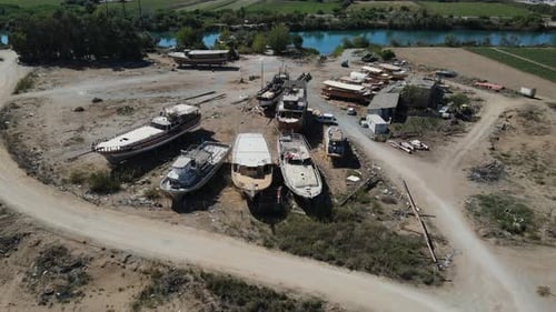 Boats Being Repaired at the Small Shipyard By the River