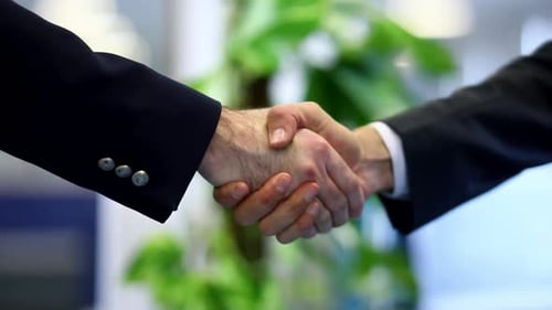 Successful Business Handshake Agreement in the Workplace