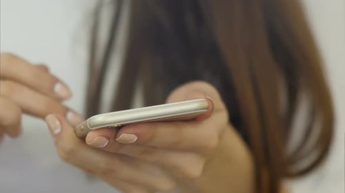 Adult Using Cell Phone Close Up