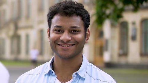 Young Man Smiling on College Campus