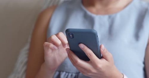 Woman use of mobile phone at home