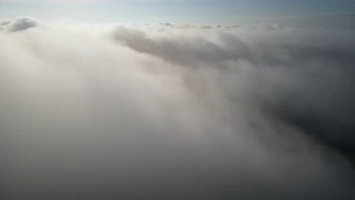 Aerial fly over the white cloud
