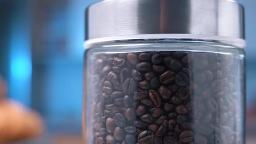 Close Up of Coffee Beans in Glass Jar