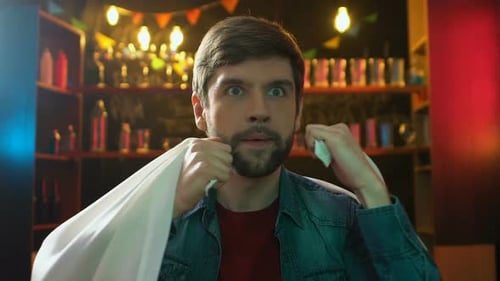 Excited Male Fan Celebrating Victory Indoors