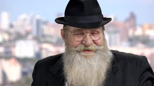 Close Up Old Bearded Man Talking To Camera
