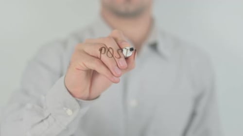 Individual Writing Positive Attracts Positive With a Marker