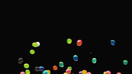 Colorful Spheres Rising and Falling on Black