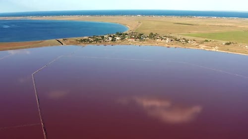 Beautiful top view of the salty, pink lake. Beautiful pink sunset.