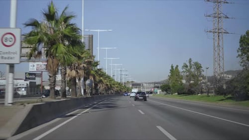 Cars Driving on Highway of Barcelona. Automobiles Moving Along City Street