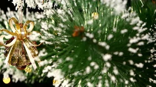 Festive Christmas Tree with Golden Bauble Ornament