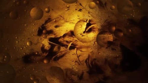 Abstract Liquid with Golden Oily Bubbles