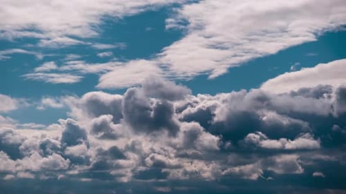 Dramatic Storm Clouds Rolling Across Blue Sky