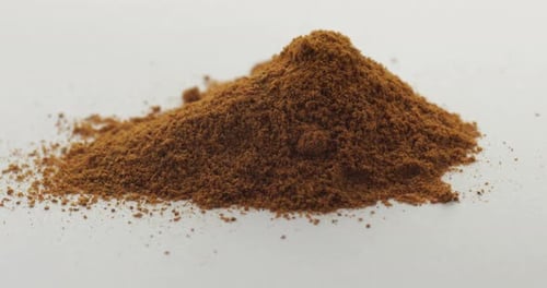 Pile of Brown Powder Filling Up Close