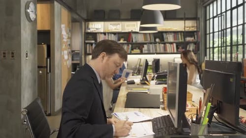 Team of Professionals Working Together in Office