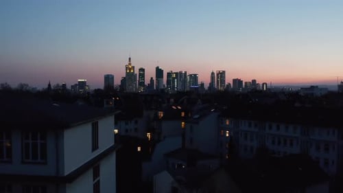 Rising Drone Footage Revealing Cityscape in Blue Hour