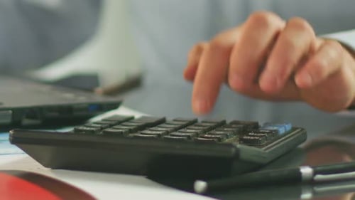 Busy Manager Calculating Budget and Working on Laptop, Business and Money