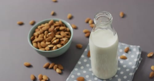 Almond Milk and Whole Almonds on Tabletop