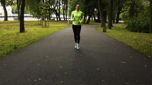 Sport Woman Running in Park Exercising Outdoors