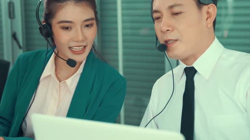 Business People Wearing Headset Working Actively in Office