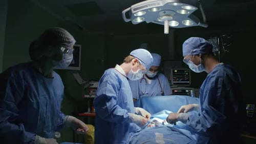 Surgeons Performing an Operation in Operating Room