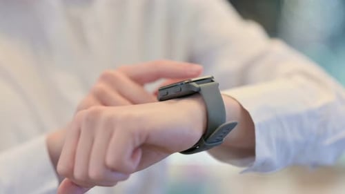 Female Hands Using Smartwatch Close Up
