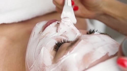 Elegant Facial Mask Treatment in a Bright Salon