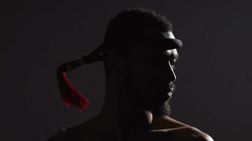 Strong Afro-American Muay Thai Boxer With Mongkon Headband On, Challenging Rival