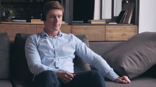 Guy Using Headphones Enjoy Jazz Indoors