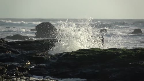 Waves Crashing on Rocky Coastline at the Ocean