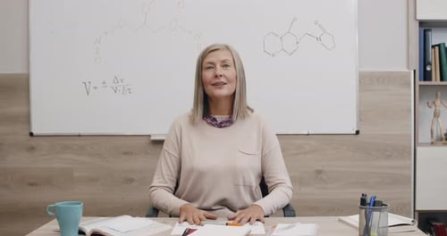 Crop View of Mature Smart Woman Talking While Having Lesson