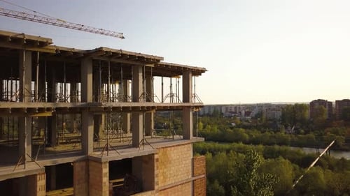 Aerial view of tall residential apartment buildings under construction.