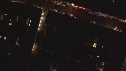 AERIAL: Slow Overhead Shot of City at Night with Lights and Traffic, Cologne, Germany