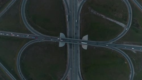 Aerial View of Highway and Overpass in City.
