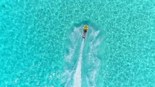 Aerial drone view of jetski personal watercraft in Bora Bora tropical island
