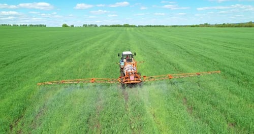 Tractor with Sprayer in the Field