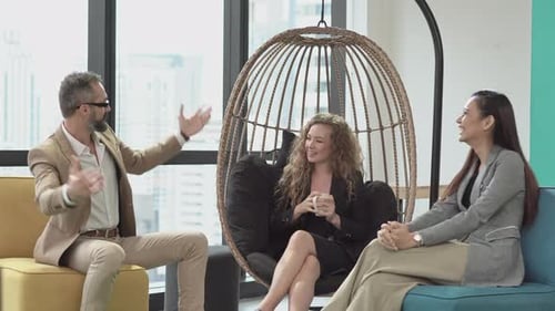 Business man giving high five to team colleague at office meeting
