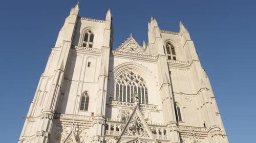 In front of blue sky Gothic art facade of religious monument 4K 2160p 30fps UltraHD footage - Famous