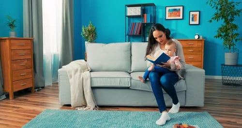 Woman Reads to Baby in Bright Living Room