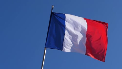 French Flag Waving Against Blue Sky