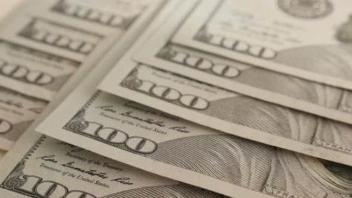 Hundred dollar close-up 4K 2160p 30fps UltraHD tilting footage - USA paper currency in a row slow