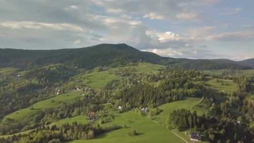 Aerial View of Green Spring Countryside in Carpathian Mountains in Sunny Evening