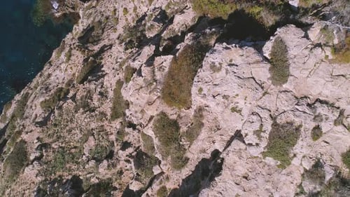 Transparent sea water near stony remote coast