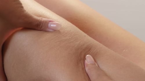 Close Up of Legs Being Massaged by Hands