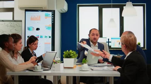 Professionals Collaborate During a Meeting in an Office