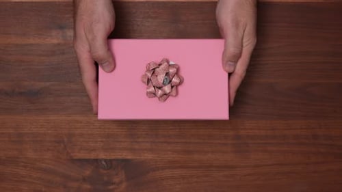 Pink Gift Box on Wooden Surface