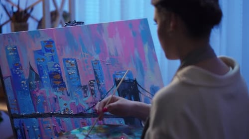 View From Back of an Artist Painting Picture on Canvas in Creative Workshop