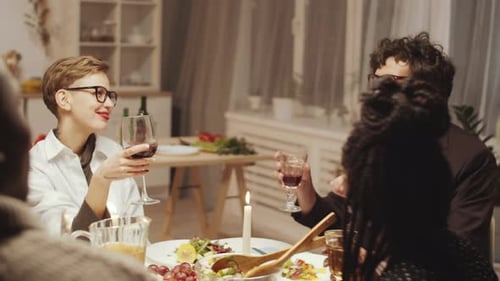 Friends Enjoying Dinner Party with Wine